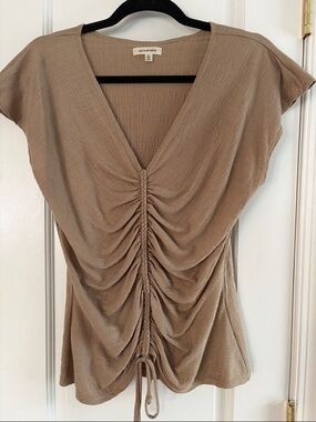 Tan v neck top.
